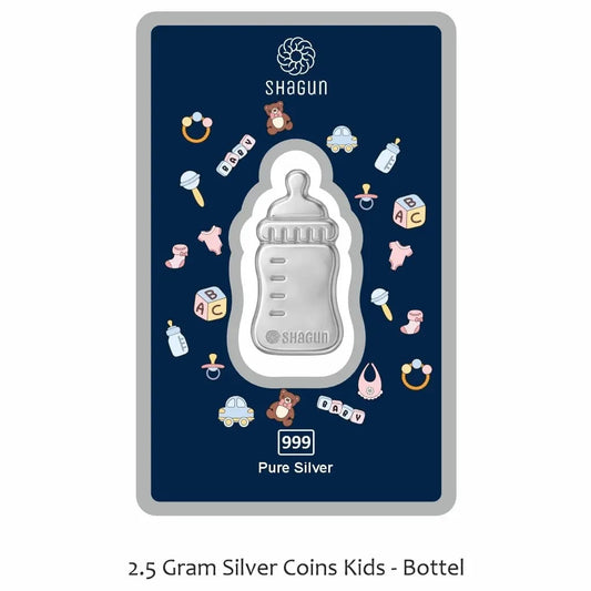 A Shagun Coins 2.5 gram pure silver baby bottle coin presented on its dark navy blue backing card, which features baby-themed illustrations.